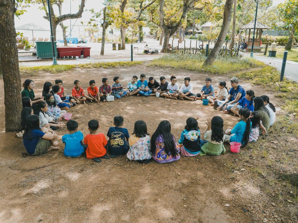 Students review what they study by meditating in circle