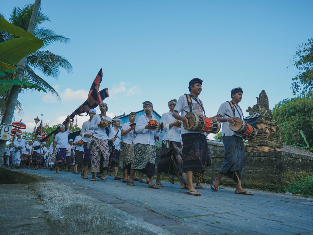 The local community celebrating within the village