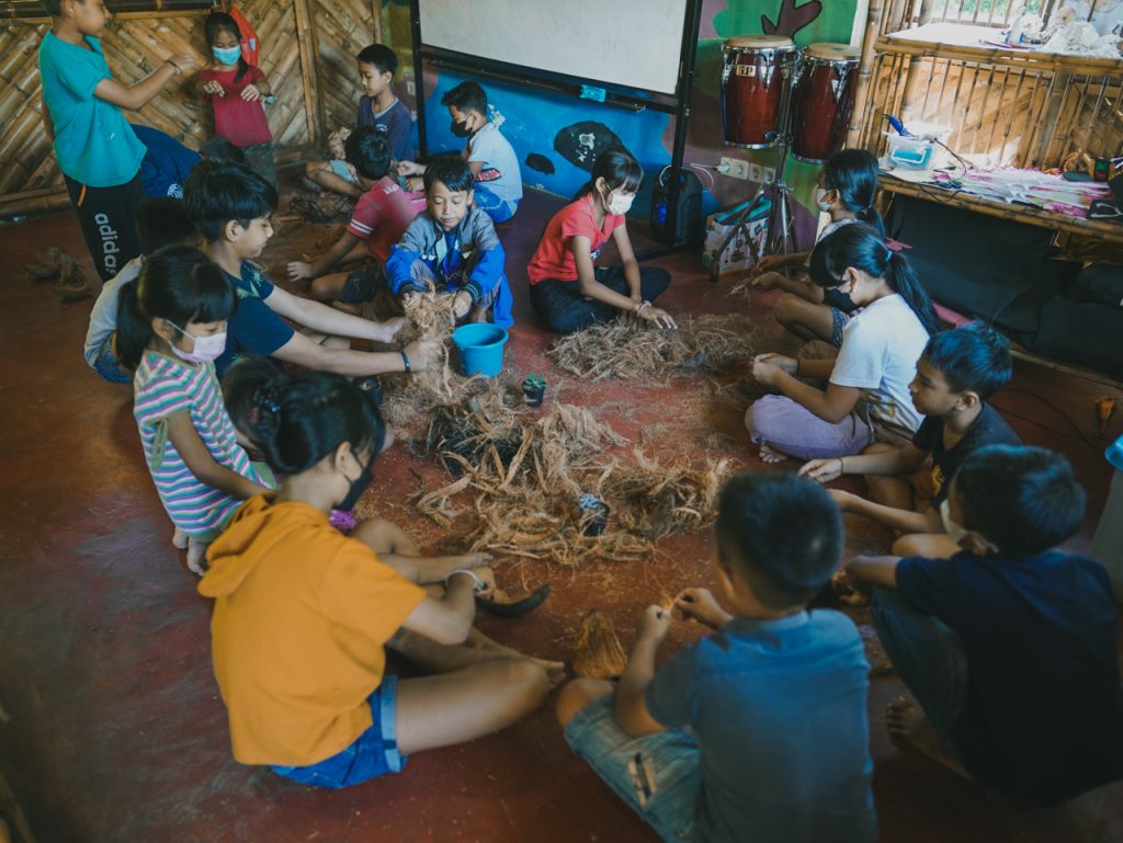 holiday program - Students making kokedama from coconut fibre